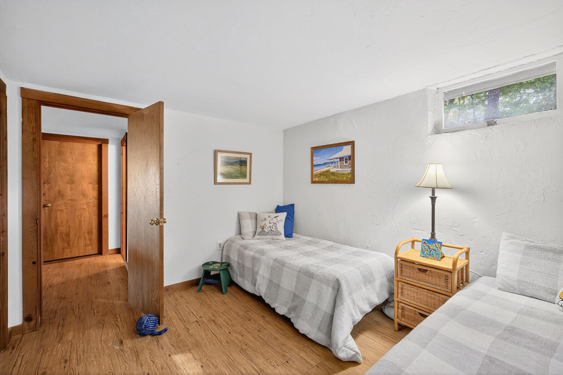 90 Blue Heron Road Wellfleet, MA 02667 - Photo 39 of 54 a bedroom with a bed and wooden floor