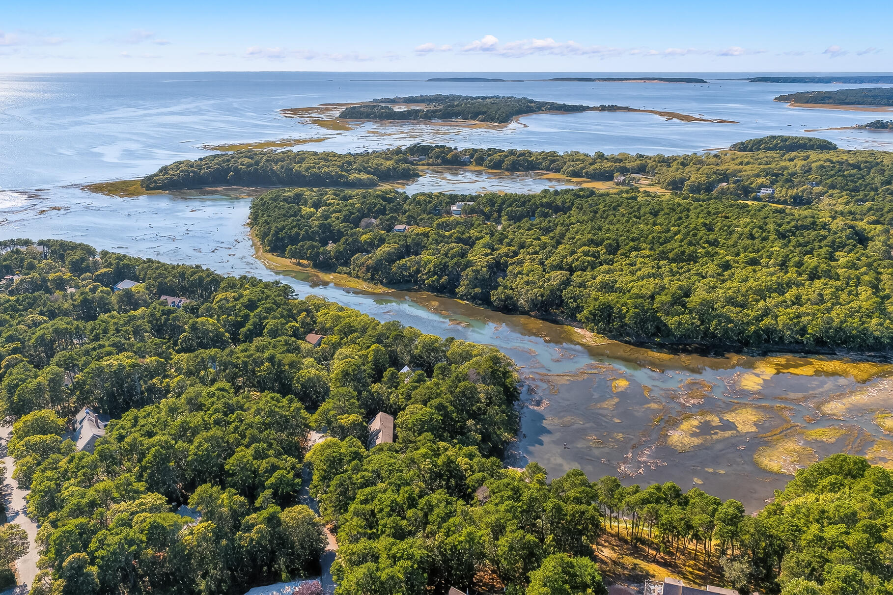 90 Blue Heron Road Wellfleet, MA 02667 - Photo 45 of 54 a view of a lake with a beach