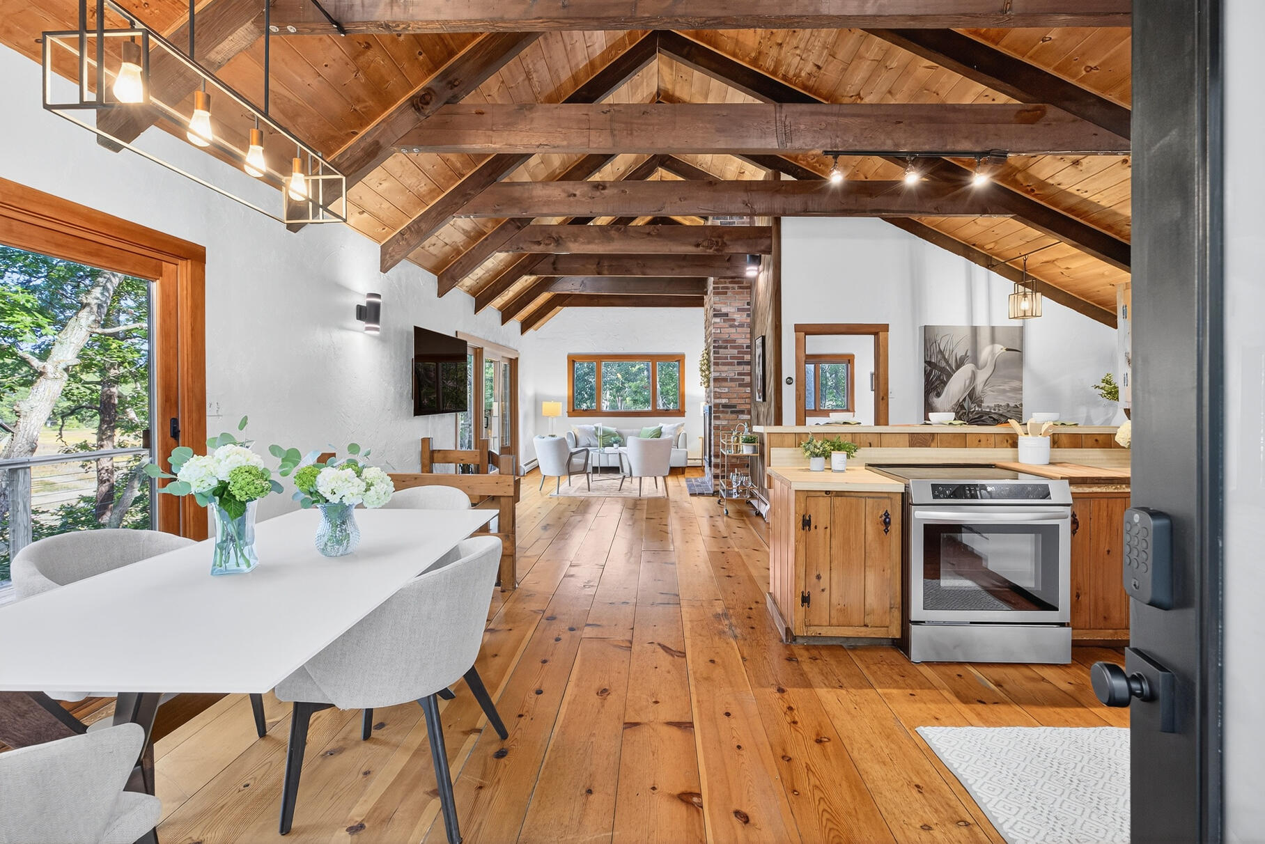90 Blue Heron Road Wellfleet, MA 02667 - Photo 7 of 54 a dining room with a table chairs and a table