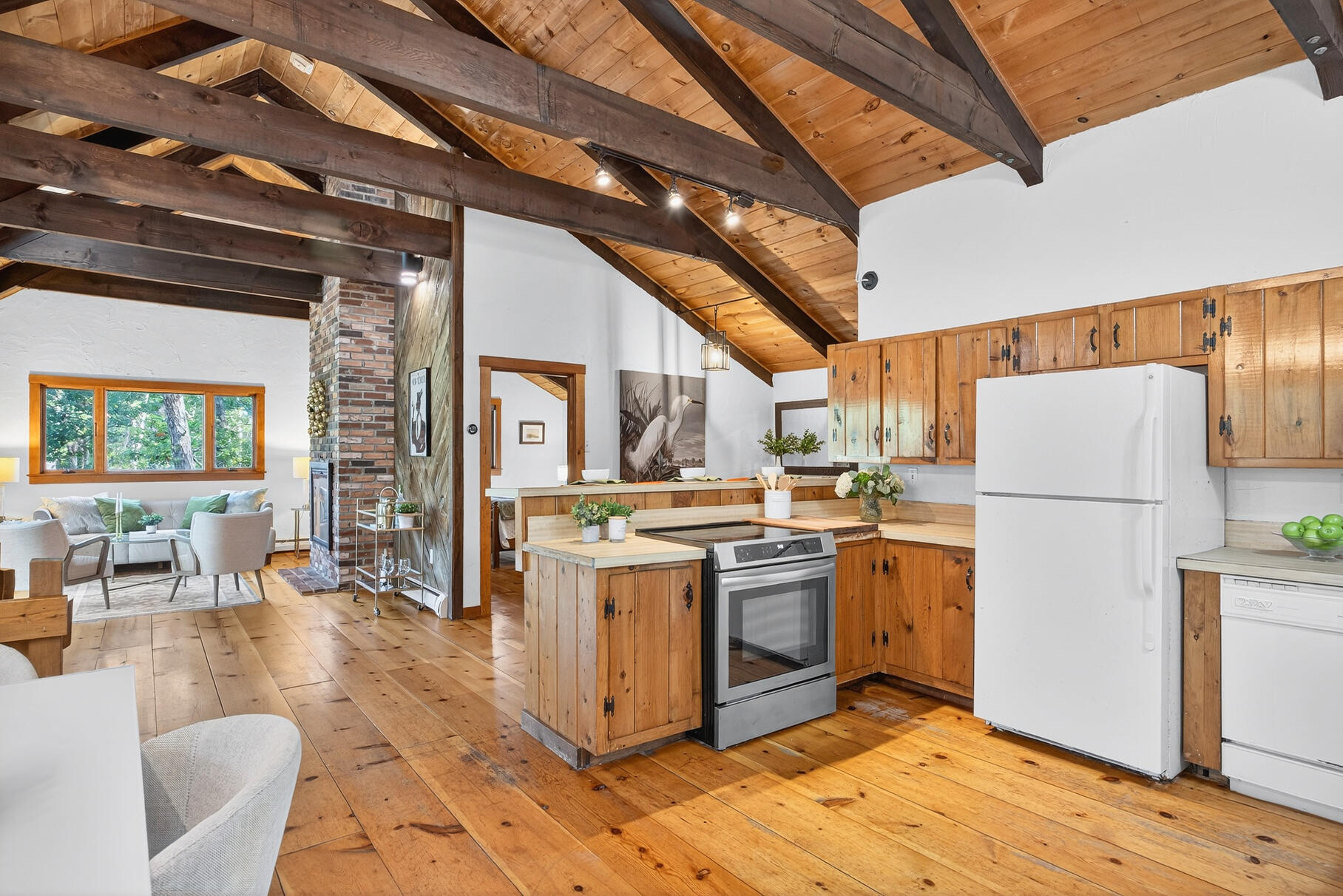 90 Blue Heron Road Wellfleet, MA 02667 - Photo 8 of 54 a kitchen with a stove a refrigerator and cabinets