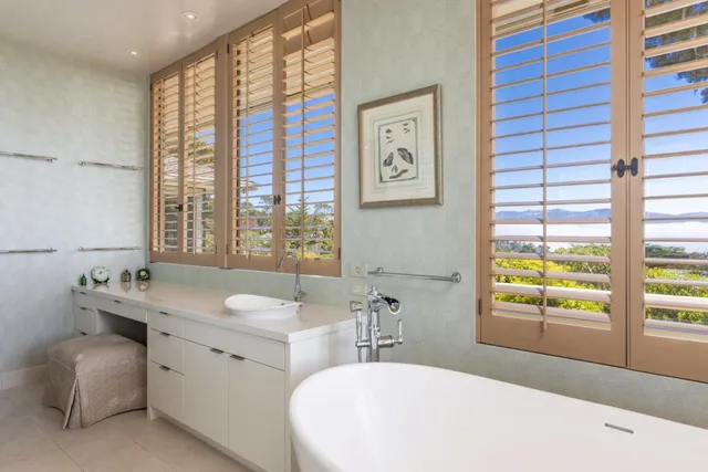 a bedroom with two beds and a couch