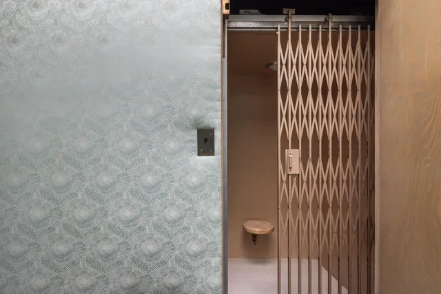 a view of a balcony with an outdoor seating