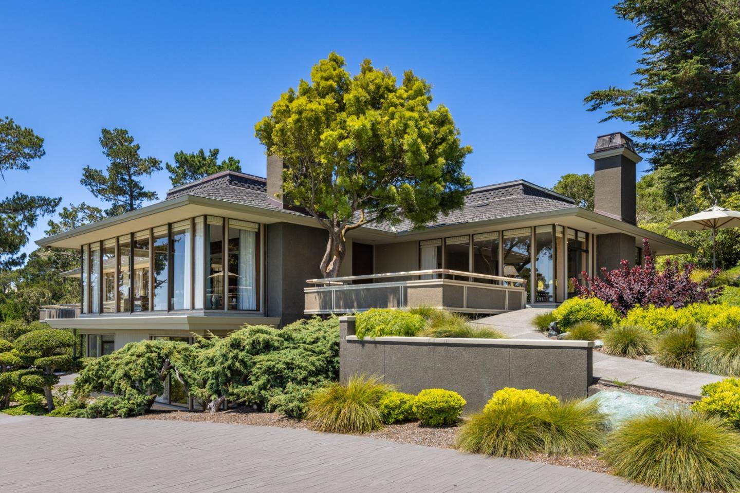 1483 Bonifacio Road Pebble Beach, CA 93953 - Photo 3 of 44 a front view of a house with a yard