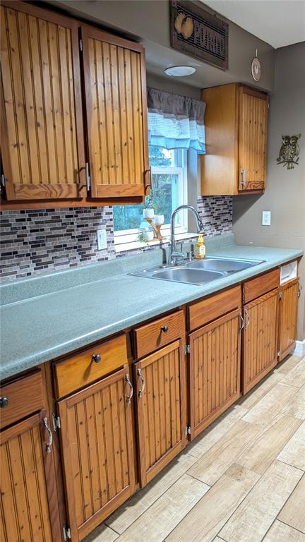 2024 East Keysville Road Lithia, FL 33547 - Photo 12 of 37 a kitchen with stainless steel appliances granite countertop wooden cabinets a sink and dishwasher