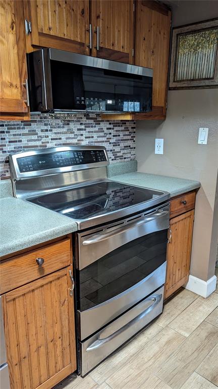 2024 East Keysville Road Lithia, FL 33547 - Photo 13 of 37 a stove top oven sitting inside of a kitchen