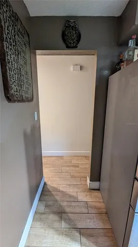 a view of an entryway with wooden floor