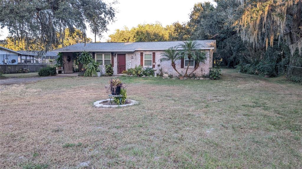 2024 East Keysville Road Lithia, FL 33547 - Photo 2 of 37 a front view of a house with garden