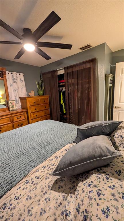 2024 East Keysville Road Lithia, FL 33547 - Photo 23 of 37 a bedroom with a large bed and a window