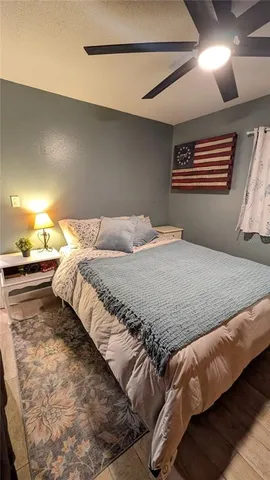 a bedroom with a bed and a table