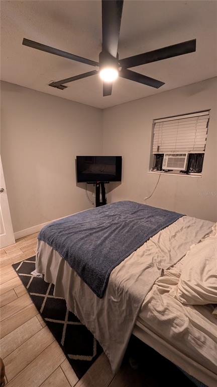 2024 East Keysville Road Lithia, FL 33547 - Photo 26 of 37 a bedroom with a bed and a lamp on the dresser