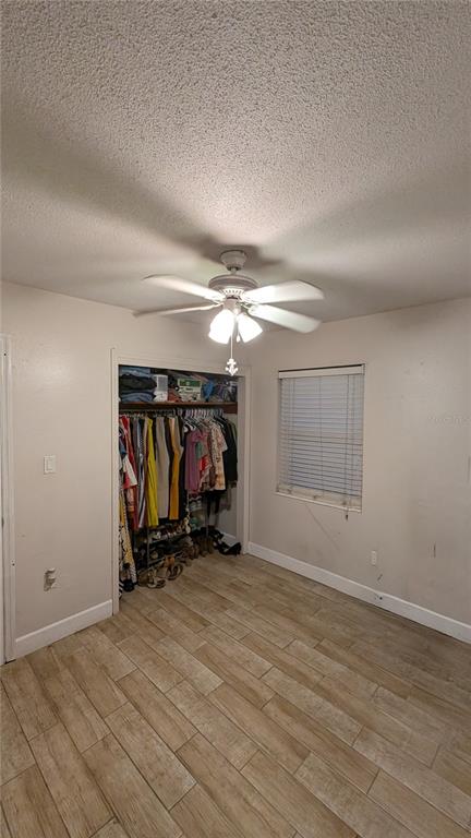 2024 East Keysville Road Lithia, FL 33547 - Photo 27 of 37 an empty room with wooden floor and windows