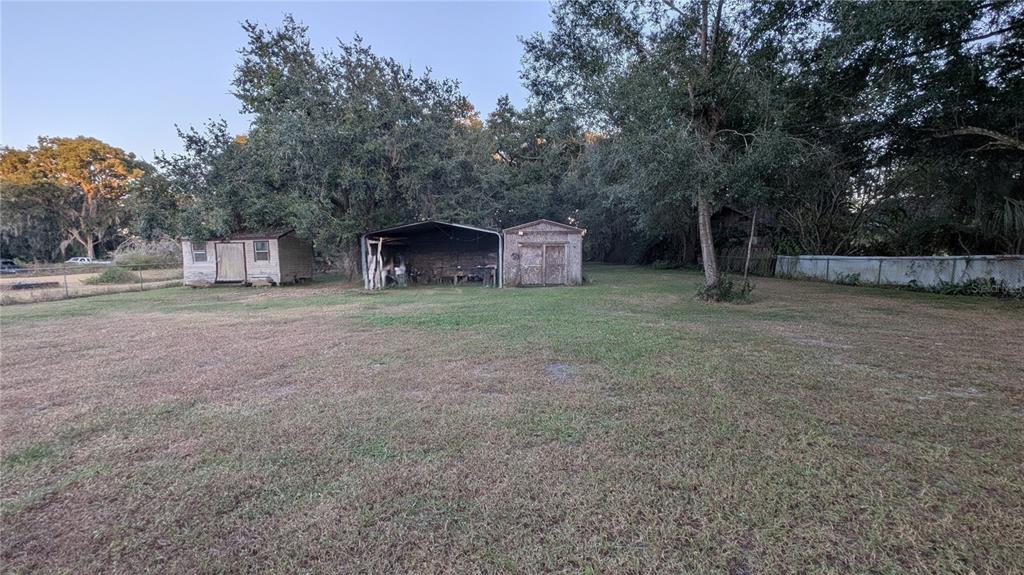 2024 East Keysville Road Lithia, FL 33547 - Photo 31 of 37 a view of a house with a yard