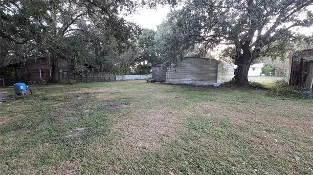 a view of a big yard with green space
