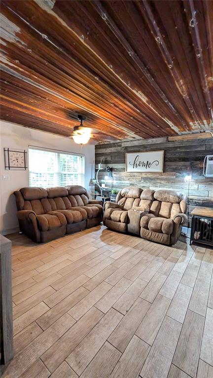 2024 East Keysville Road Lithia, FL 33547 - Photo 7 of 37 a living room with furniture and a chandelier
