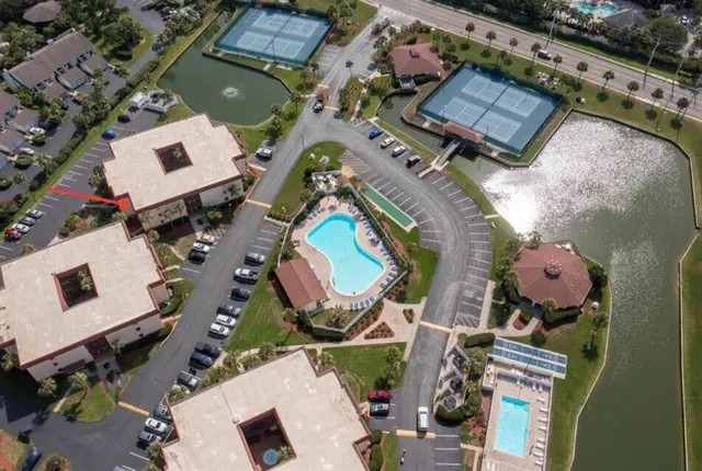an aerial view of a house with outdoor space