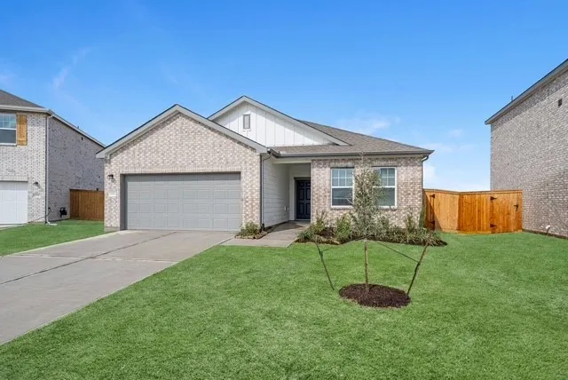 a view of a backyard with a barbeque grill and a garden