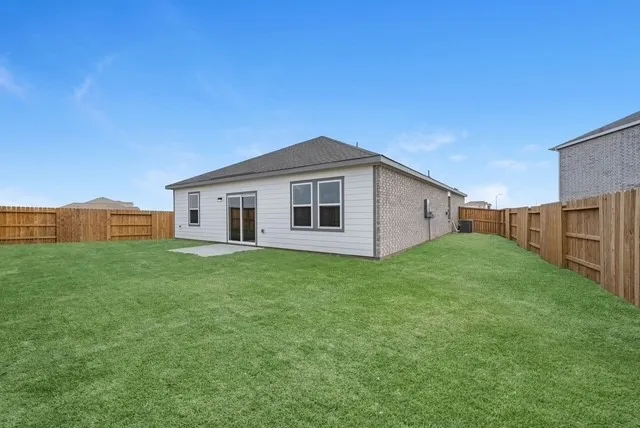 a view of a backyard of the house