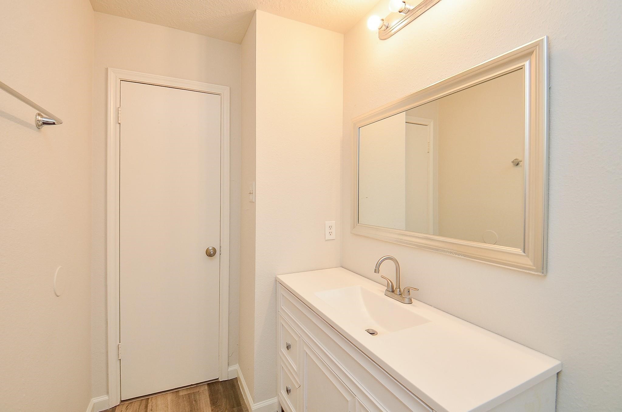11818 Spring Grove Drive Houston, TX 77099 - Photo 16 of 18 a bathroom with a sink and a mirror
