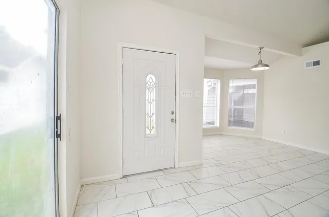 a view of staircase with white walls and white walls