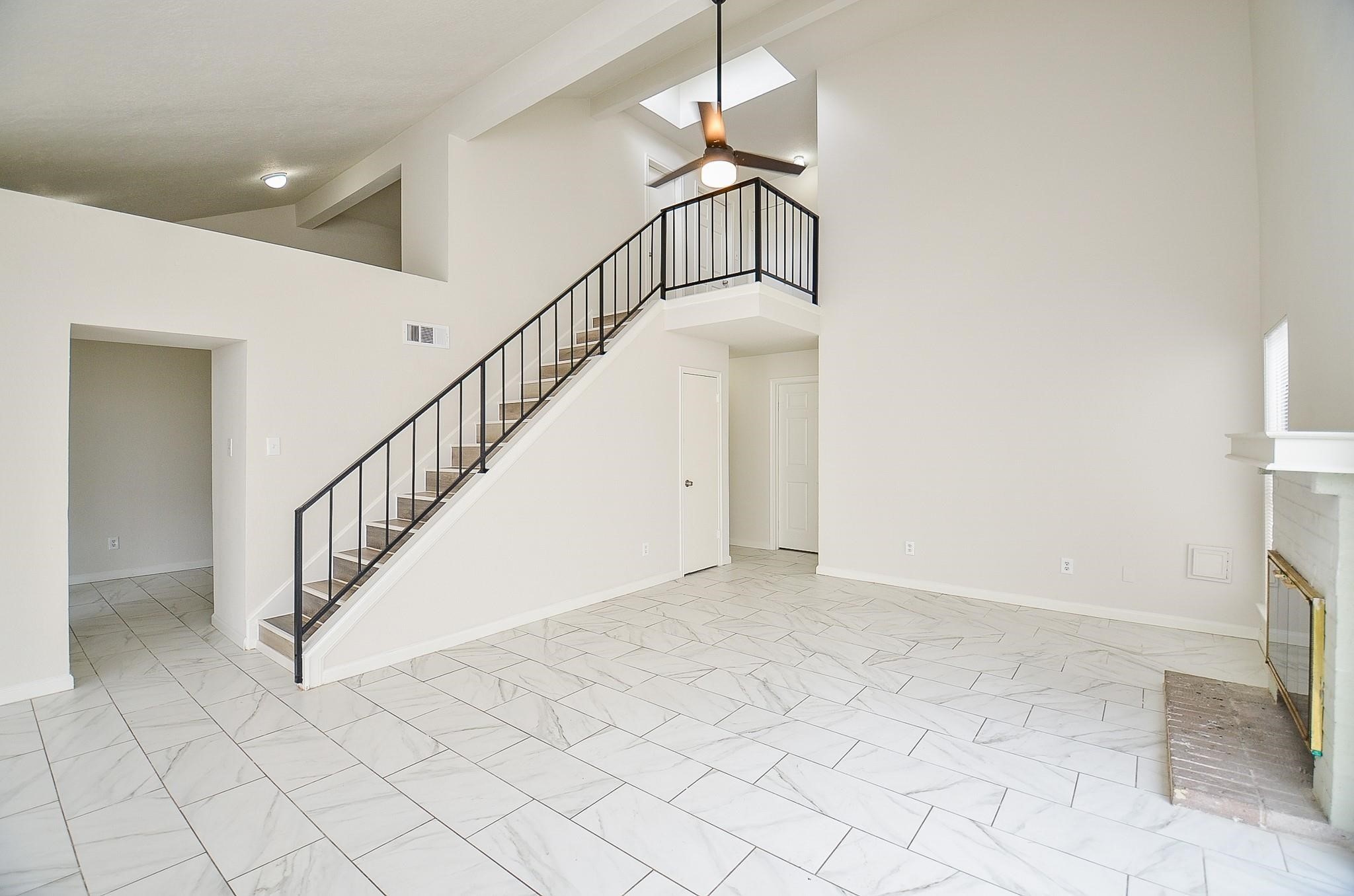 11818 Spring Grove Drive Houston, TX 77099 - Photo 5 of 18 a view of staircase with white walls and white walls