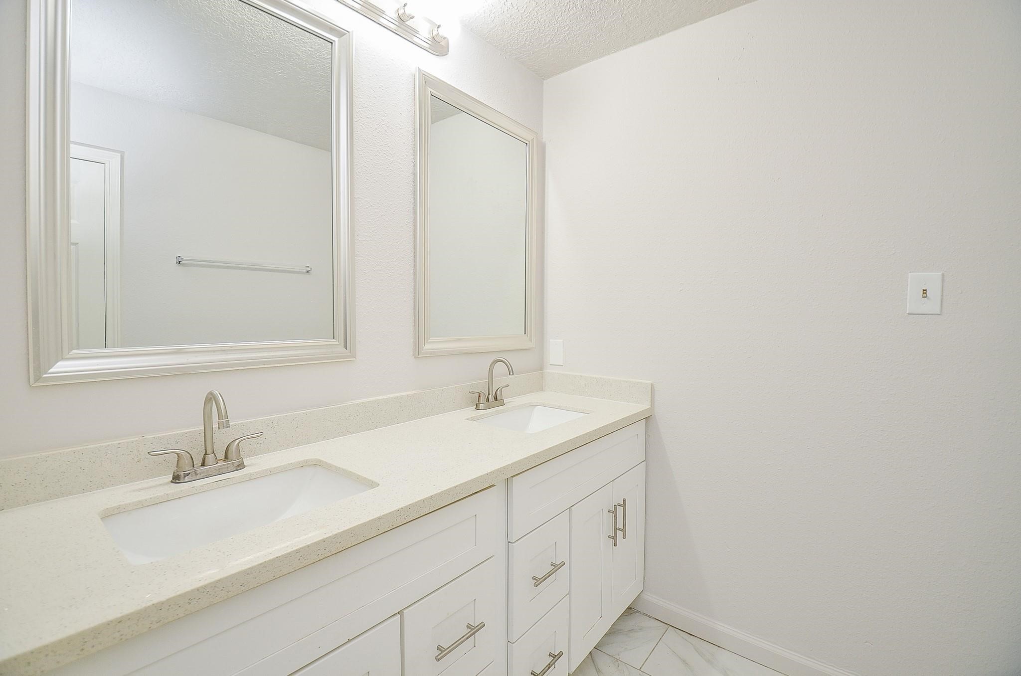 11818 Spring Grove Drive Houston, TX 77099 - Photo 10 of 18 a bathroom with a sink and a mirror
