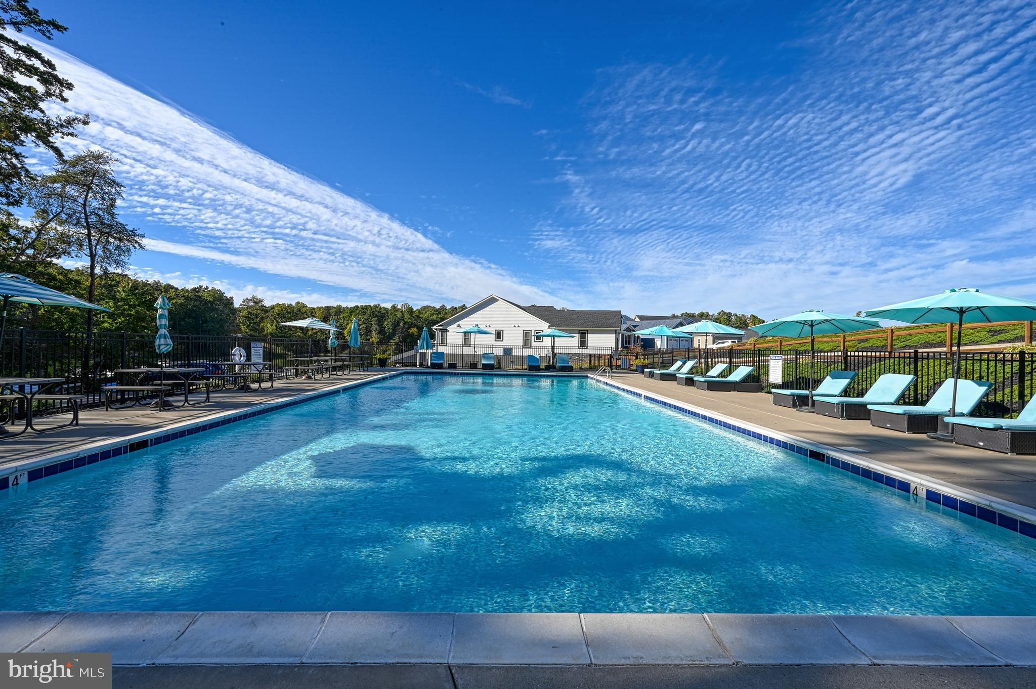 Lot 46 Sunset Loop Mineral, VA 23117 - Photo 5 of 10 a view of a swimming pool with an outdoor space and seating area