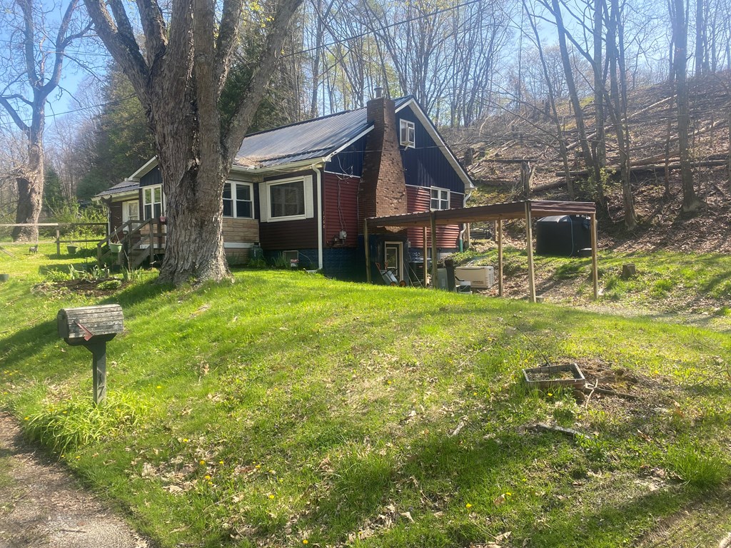 1760 Jordan Hollow Road Parker, PA 16049 - Photo 2 of 52 a view of a house with a yard porch and sitting area