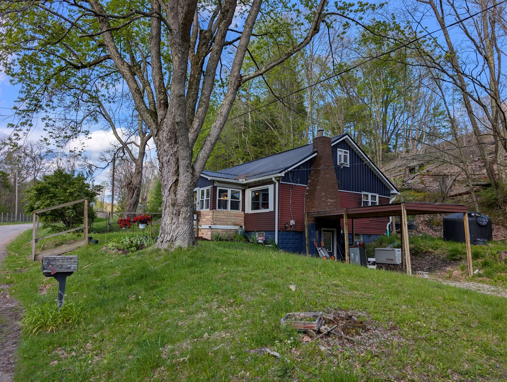 1760 Jordan Hollow Road Parker, PA 16049 - Photo 23 of 52 front view of a house with a yard