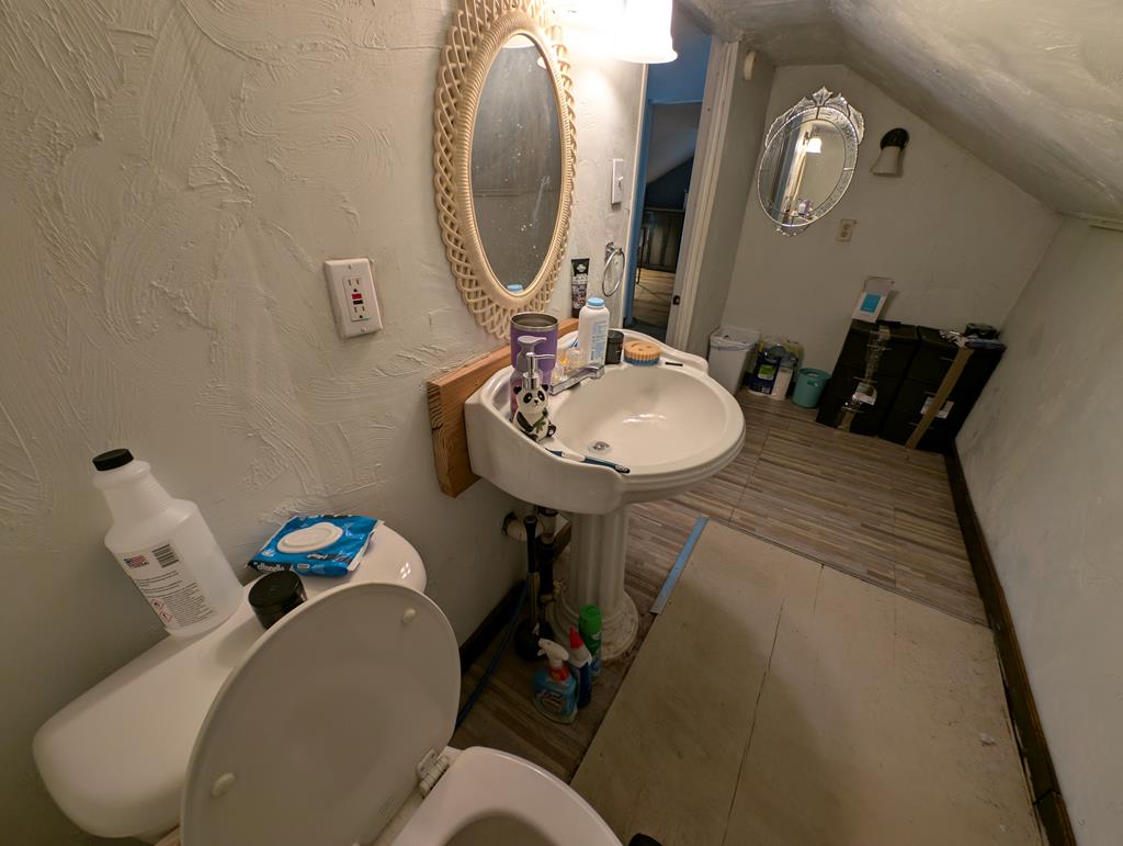 1760 Jordan Hollow Road Parker, PA 16049 - Photo 51 of 52 a bathroom with a sink mirror and toilet