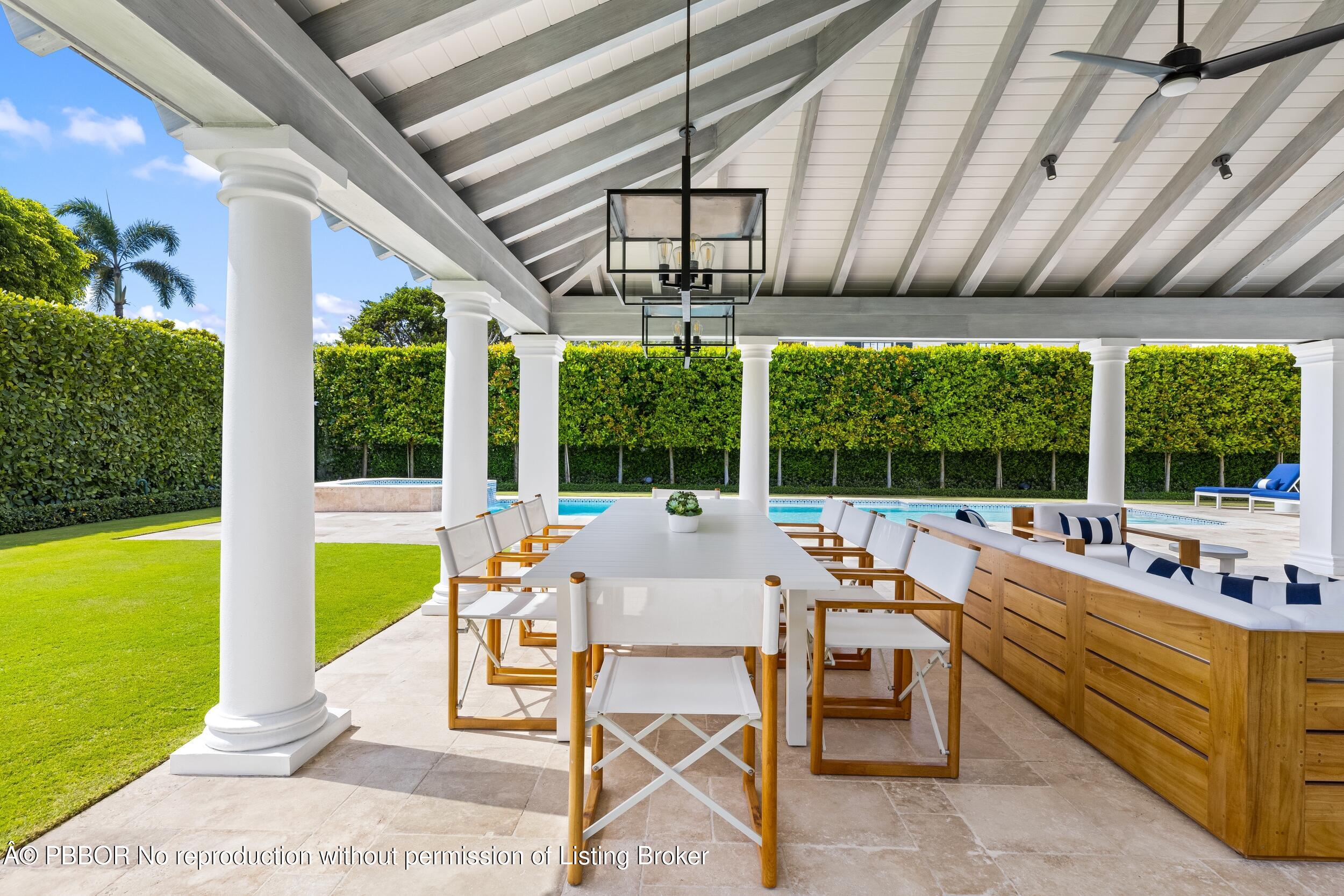 201 Banyan Road Palm Beach, FL 33480 - Photo 31 of 42 a living room with furniture and a large window