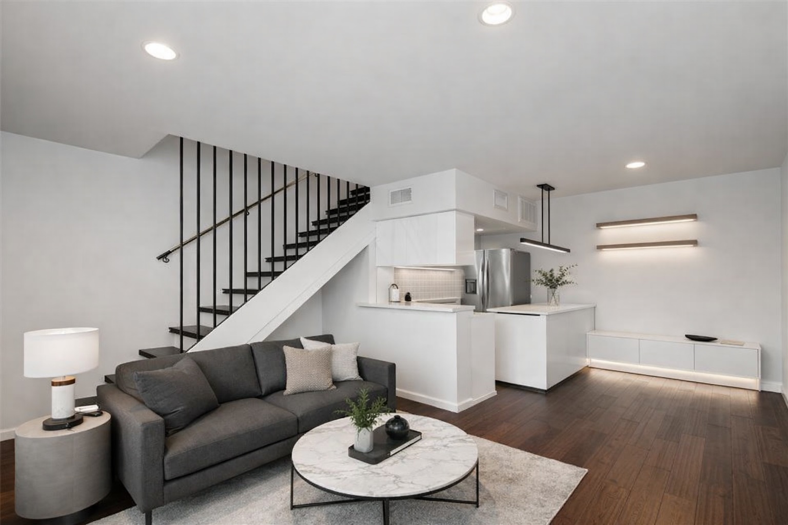 3110 Red River Street, Unit 220 Austin, TX 78705 - Photo 2 of 7 a living room with furniture and a dining table with wooden floor