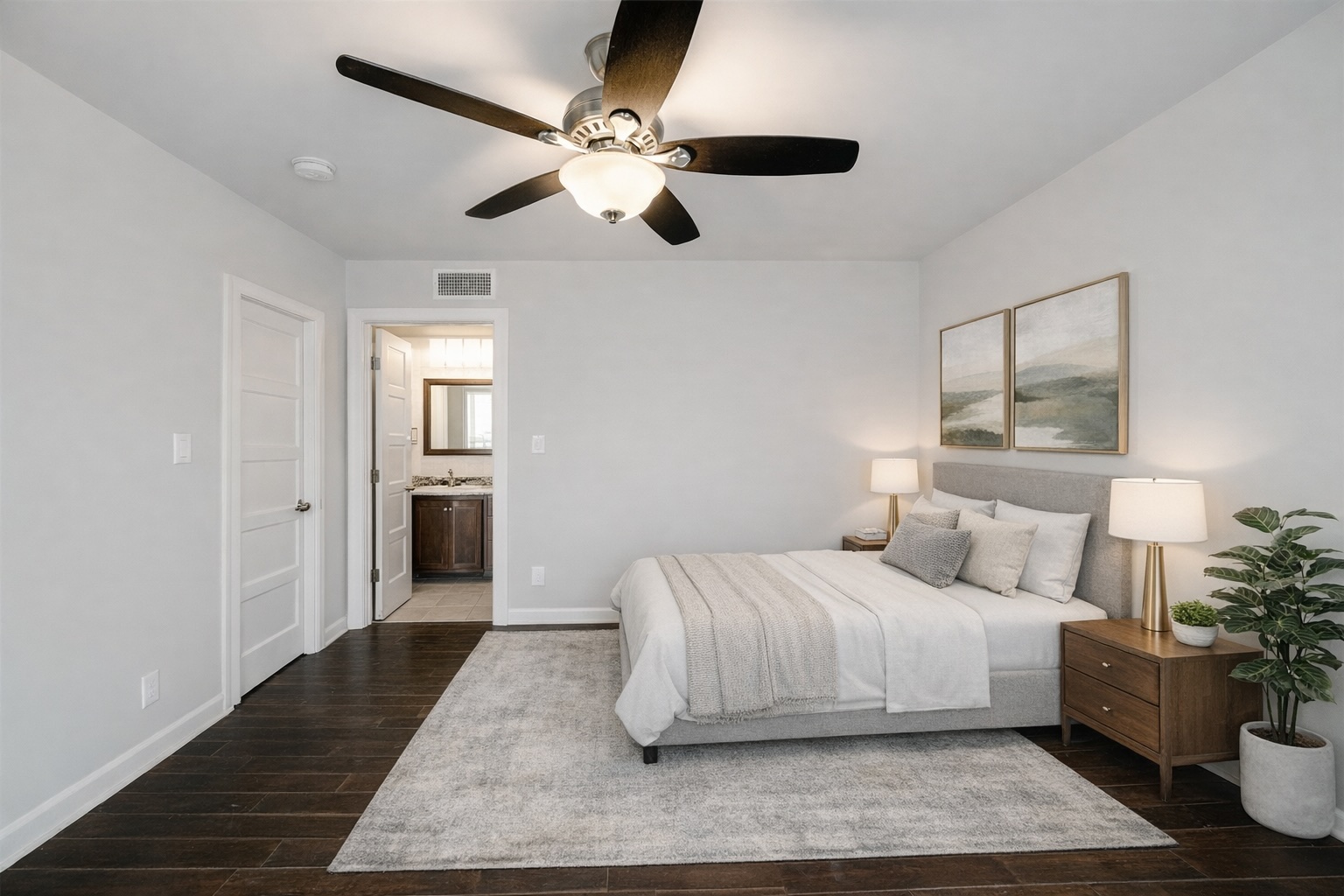 3110 Red River Street, Unit 220 Austin, TX 78705 - Photo 3 of 7 a bedroom with a large bed and a chandelier