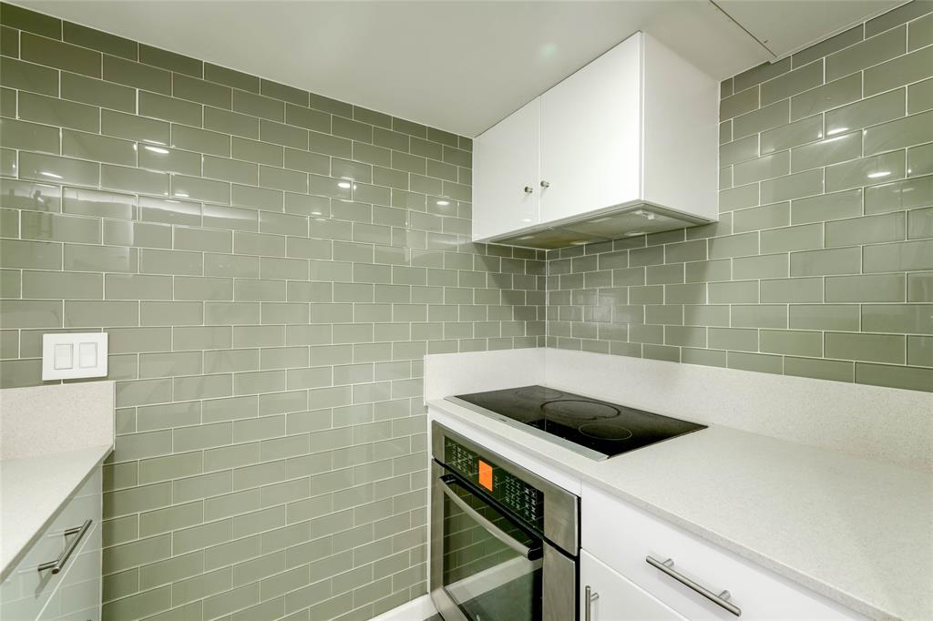 3110 Red River Street, Unit 220 Austin, TX 78705 - Photo 4 of 8 a bathroom with a sink a toilet and shower