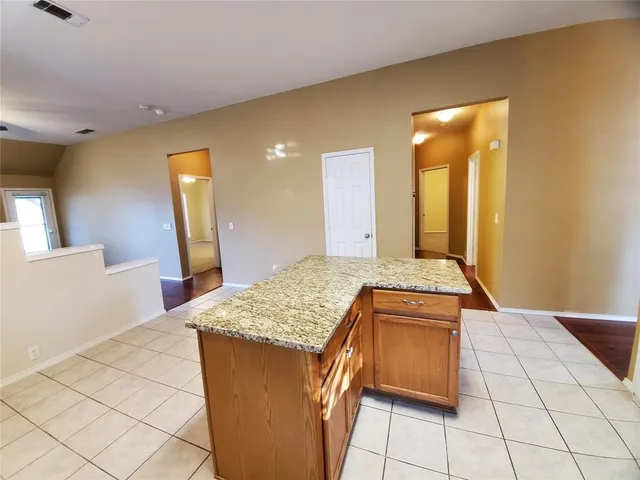 a kitchen with a sink dining table and utility room