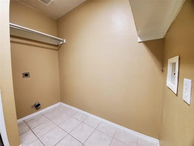 a view of a room with wooden walls