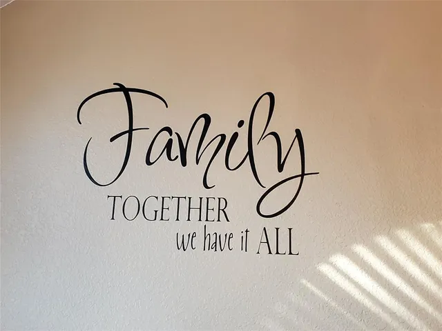 a sign on a wall next to a white wall