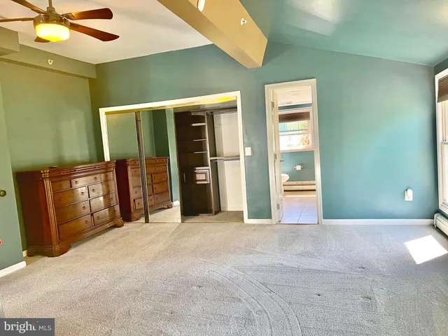 a view of an empty room with a balcony