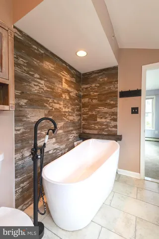 a bathroom with a bathtub and shower