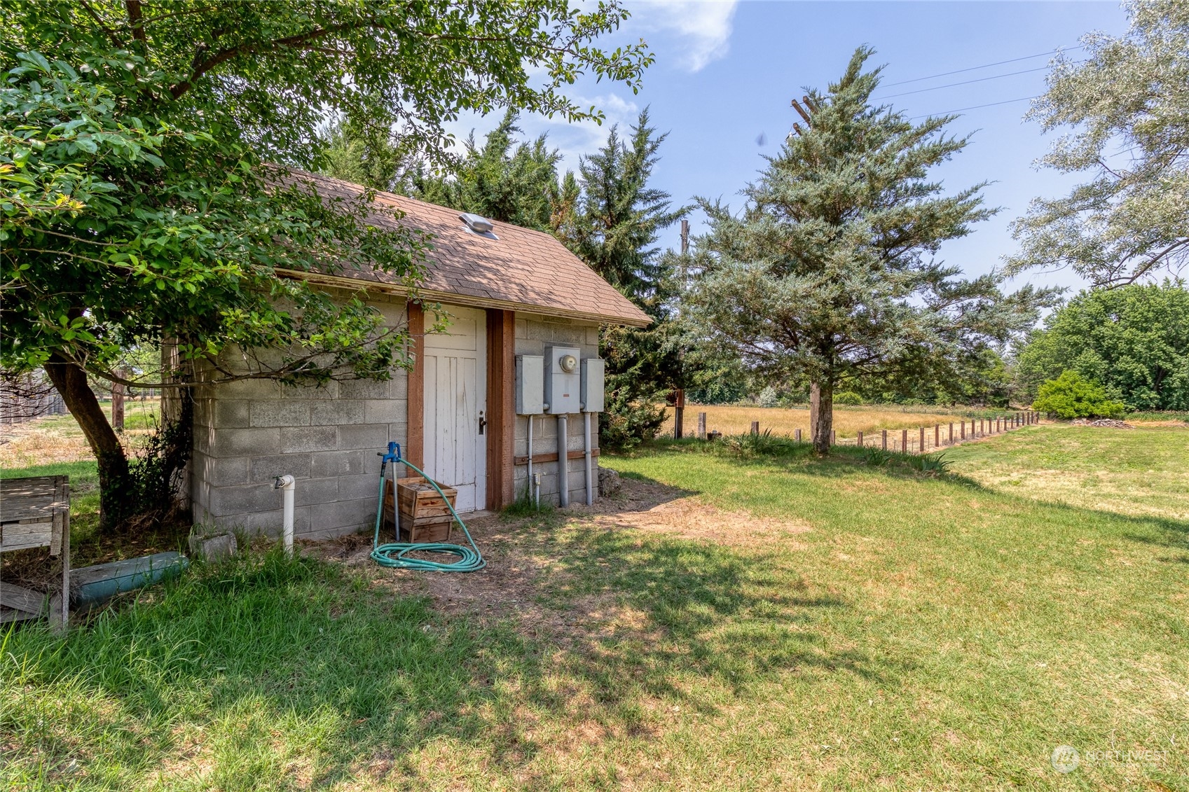 1444 Stovall Road Walla Walla, WA 99362 - Photo 6 of 27 a view of a house with backyard and a tree