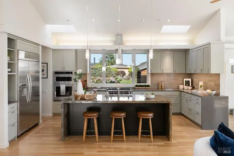 a view of a balcony with floor to ceiling windows with wooden floor