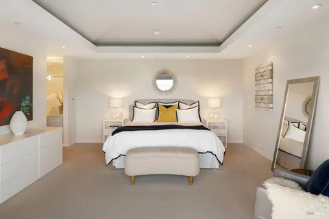 a bathroom with a tub sink and large window