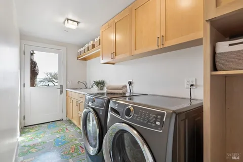 a bathroom with a double vanity sink and a mirror