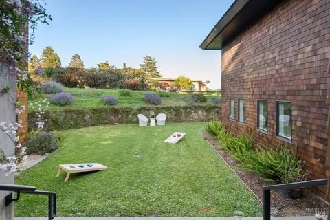 a view of a patio with couches table and chairs