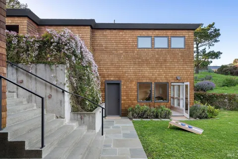 a view of a house with a backyard