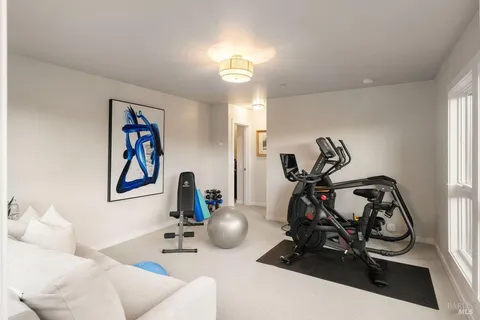 a view of a living room and floor to ceiling window