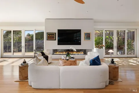 a living room with furniture window and wooden floor