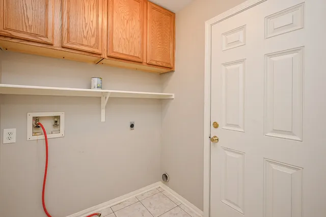 a view of storage and utility room with racks on the wall