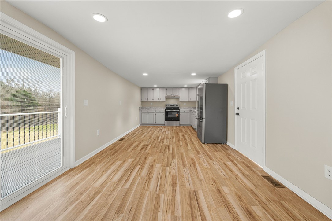 139 Davis Road Easley, SC 29640 - Photo 10 of 34 This inviting space offers an open layout, durable flooring, and convenient outdoor access.