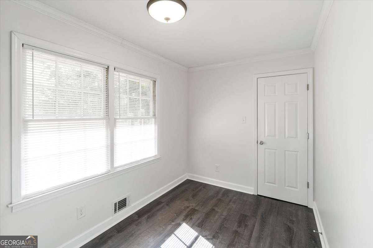 148 Bunker Drive Athens, GA 30607 - Photo 14 of 38 an empty room with wooden floor and windows