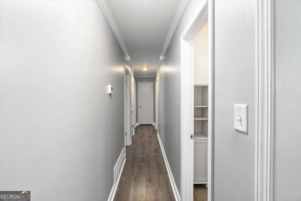 148 Bunker Drive Athens, GA 30607 - Photo 19 of 38 a view of a hallway with wooden floor and a bathroom